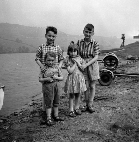 Beside Rudyard Lake, with Mike on the right, and Geoff and Sue on the left. We have no idea who the other little girl is, next to Mike.