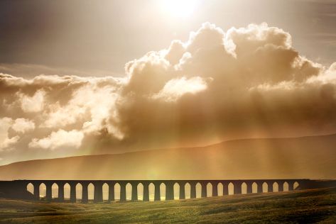 "Ribblehead Viaduct in North Yorkshire" by Michael Bryan - originally posted to Flickr as Here comes the sun.... Licensed under CC BY 2.0 via Commons - https://commons.wikimedia.org/wiki/File:Ribblehead_Viaduct_in_North_Yorkshire.jpg#/media/File:Ribblehead_Viaduct_in_North_Yorkshire.jpg